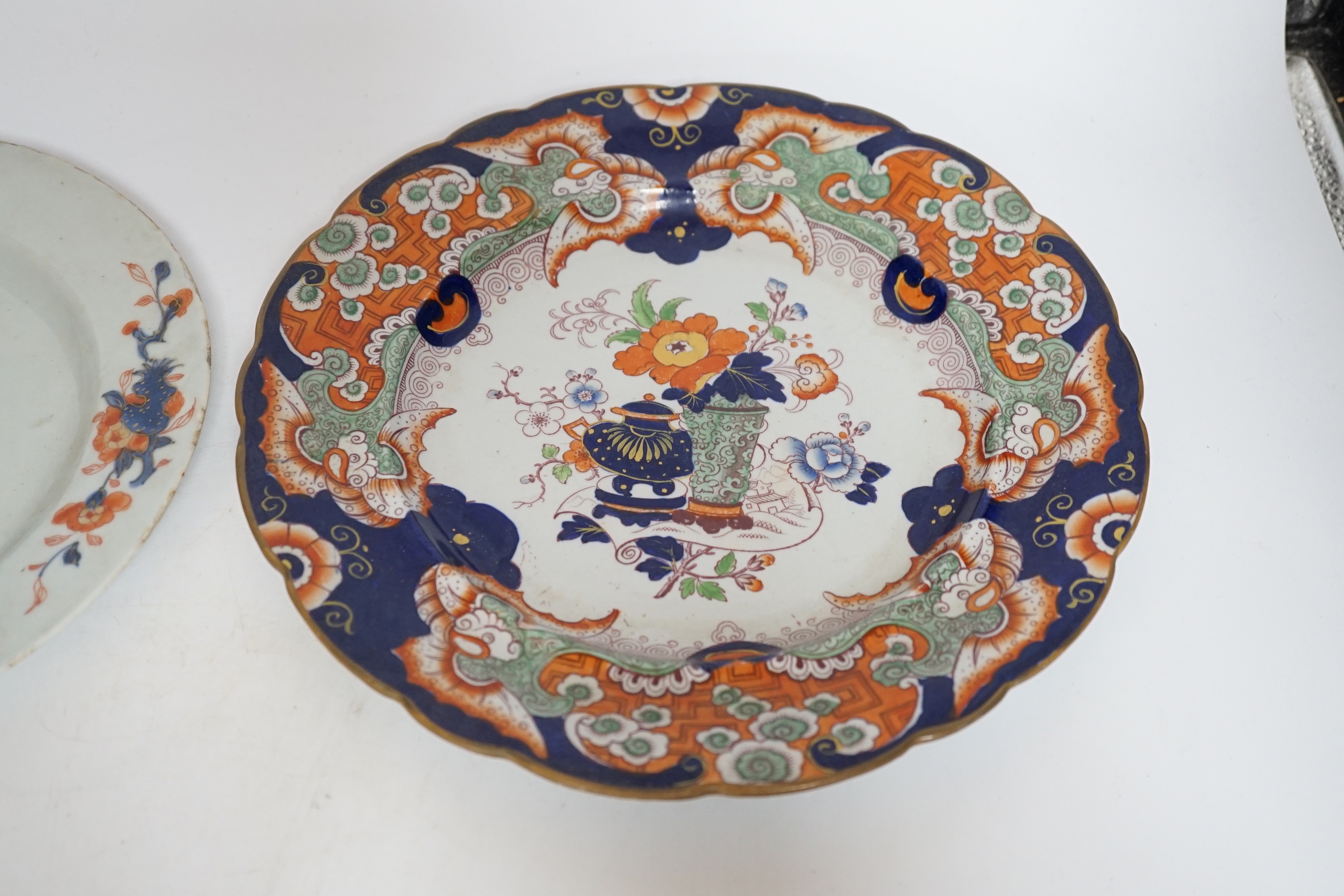 Two late 18th century pearlware Prattware plates, a Chinese export plate and an ironstone plate, largest 27cm in diameter